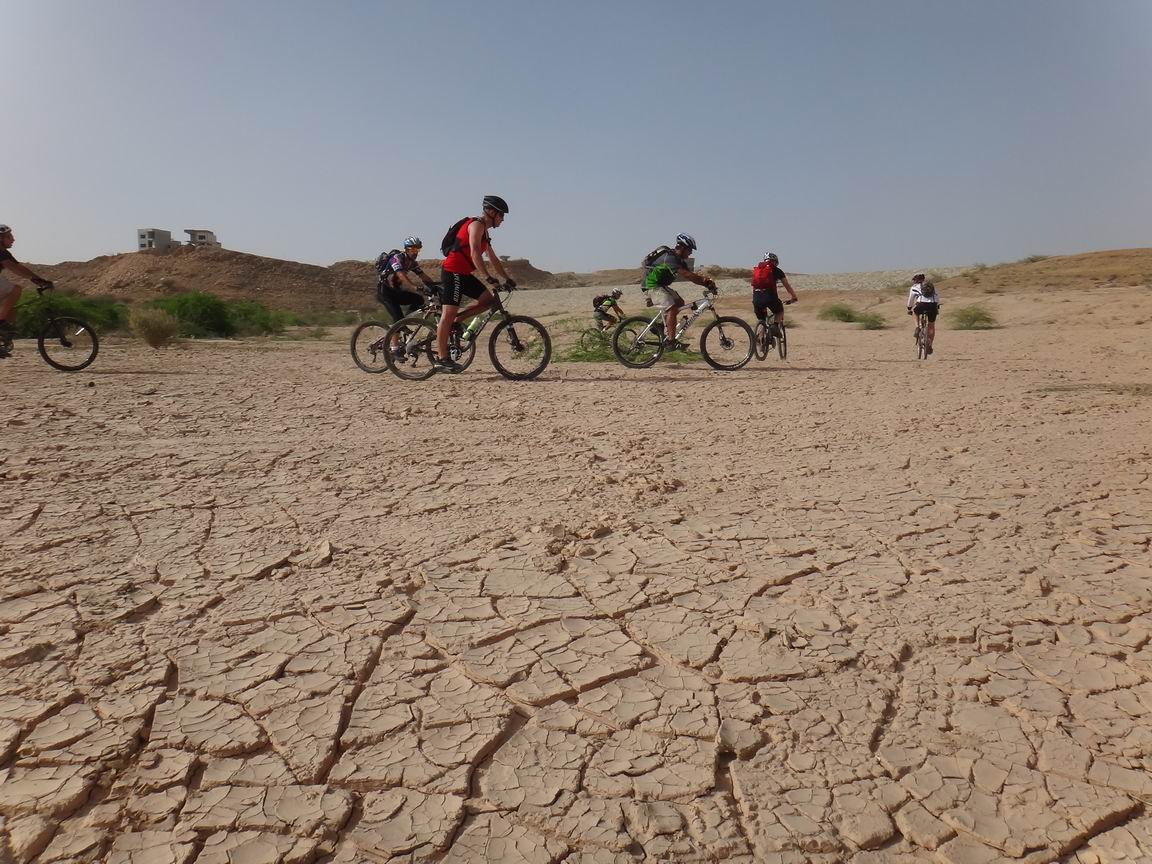 we found our way via dried wadi, mud crust crunching below our wheels